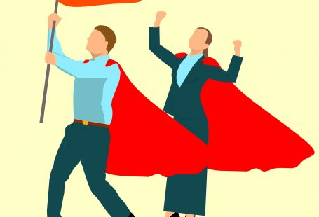 un disegno che raffigura un uomo e una donna con un mantello rosso, l'uomo che tiene in mano una bandiera rossa, le donna con le braccia alzate